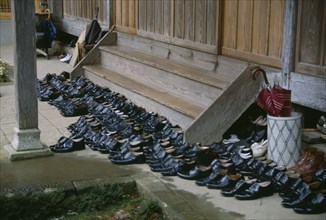 JAPAN, Buddhism, Shoes left outside steps of monastery.