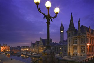 BELGIUM, East Flanders, Ghent, "View at night of the medieval core of the city over the Leie River