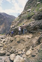 PERU, Cordillera Balnca, Huaraz, Workers clearing a land slide.