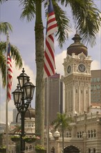 MALAYSIA, Peninsular, Kuala Lumpur, "The Sultan Abdul Samad Building with palm tree, flag and lamp