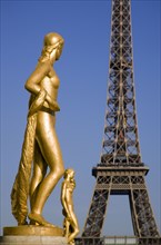 FRANCE, Ile de France, Paris, Gilded bronze statues in the central square of the Palais de Chaillot