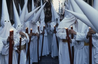 SPAIN, Andalucia, Seville, Semana Santa Holy Week penitents.