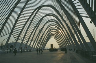 GREECE, Central, Athens, Olympic Stadium. People wandering through the walkway covered with arches