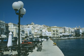 GREECE, Cyclades Islands, Syros, Ermoupolis. The town with benches and cafes at the waters edge