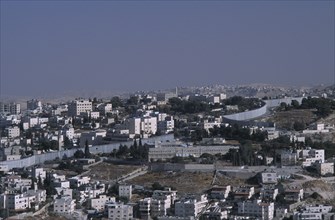 ISRAEL, East, Jerusalem, Elevated view over city architecture and The Security Fence which divides