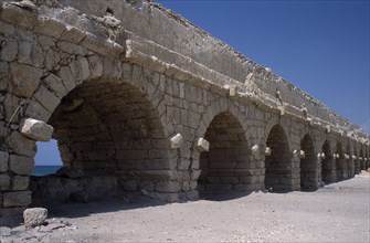 ISRAEL, Caesarea, Roman Aqueduct.  Western section with arches and wall