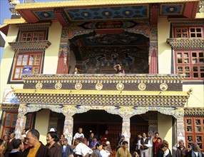 NEPAL, Kathmandu,  A highly decorated temple outside Swayambhunath Stupa busy because its the day