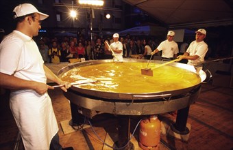 CROATIA, Istria, Buzet, "CrBuzet Subotina festival/giant omelette preparation. The highlight of the