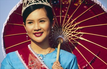 THAILAND, North, Chang Mai, "Bo Sang Umbrella fair. Thai girl with tiara and umbrella