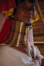 THAILAND, Chiang Rai Province, Mae Chan, Head and shoulders portrait of Paduang ‘long neck’ woman