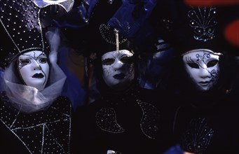 CROATIA, Kvarner, Rijeka, Mask carnival trio in Venetian masks. Venetian style masks are synonomous
