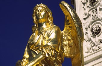 CROATIA, Zagreb, Cathedral gilded angel. Outside the cathedral stands a golden Madonna surrounded
