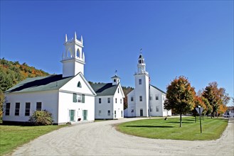 USA, New Hampshire, Washington, Whitc wooden church and autumn foliage.