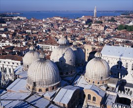 ITALY, Veneto, Venice, View from the Campanile over domed rooftops of St Mark’s Basilica and city