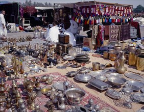 KUWAIT, Kuwait City, "Brassware, crafts and textiles for sale at the Friday Market or souq with
