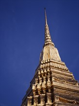 THAILAND, Bangkok, The Grand Palace.  Golden spire.