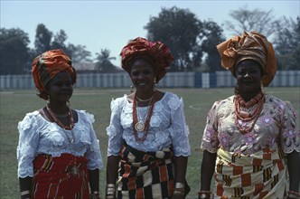 NIGERIA, People, Three-quarter portrait of three Ibo women dressed in traditional clothes for