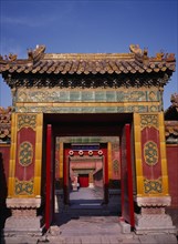 CHINA, Beijing, Forbidden City.  Looking through highly decorated sequence of doorways.