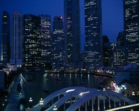 SINGAPORE, General, Singapore River basin and city skyline at night with lights from waterfront