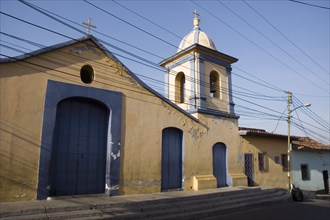 VENEZUELA, Caracas , "Church in colonial section of Petare, with telephone and power cables in the
