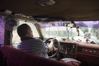 VENEZUELA, Caracas , Passenger seat view of a Caracas taxi including ventilation fan and dash-board