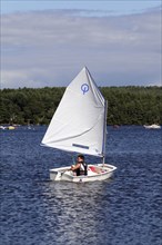 USA, New Hampshire, Meredith , Sailing dingy on Lake Winnipesaukee