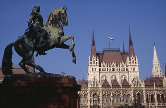 HUNGARY, Budapest, Parliament building with equestrian statue of Ferenc Rakoczi in foreground.