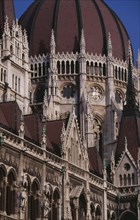 HUNGARY, Budapest, Part view of domed roof and exterior facade of Parliament building. Eastern