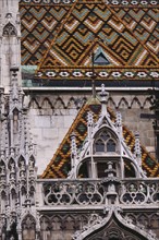 HUNGARY, Budapest, Castle Hill.  Matyas Church  detail of exterior and coloured roof tiles. Eastern