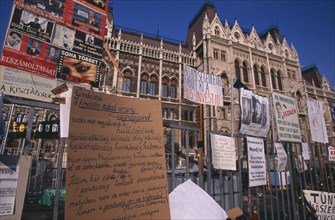 HUNGARY, Budapest, "Hand-written posters and signs attached to railings outside Parliament to