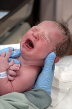 CHILDREN, Babies, Birth, "Kylan Stone, newborn baby girl being checked by nurse in hospital, crying