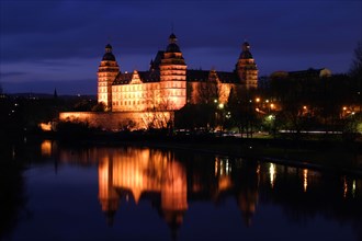 GERMANY, Aschaffenberg, Schloss Johannisburg illuminated at night.