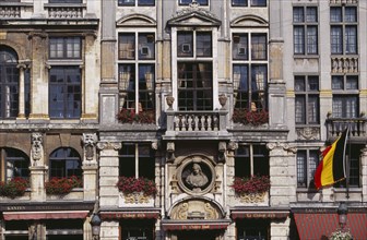 BELGIUM, Brabant, Brussels, Grand Place.  Part view of building facade with stone balconies  flower