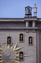 BELGIUM, Brabant, Brussels, Detail of building facade and Jacquemart clock.  Figures representing