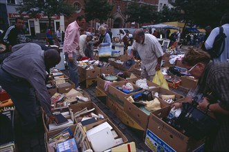 BELGIUM, Brabant, Brussels, "Flea Market. Place du Jeu de Balle, the Marolles. People rummaging
