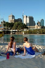 Australia, Queensland, Brisbane, Sunbathers in the Southbank Complex - Brisbane