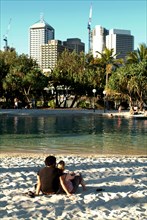 Australia, Queensland, Brisbane, Sunbathers in the Southbank Complex - Brisbane
