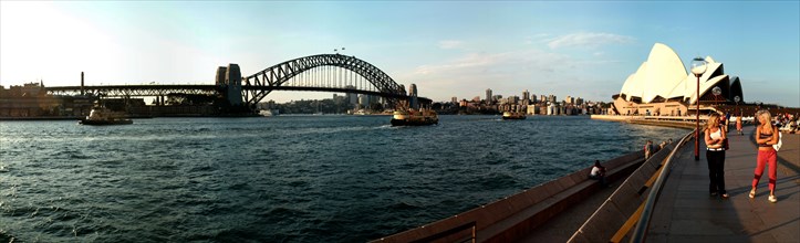 Australia, New South Wales, Sydney, Panorama Of Sydney Opera House And Harbour Bridge At Sunset