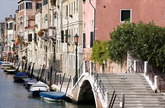 ITALY, Veneto, Venice, A bridge and colourful houses beside a canal on Fondamente della Sensa in