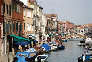 ITALY, Veneto, Venice, The main canal beside Fondamente dei Vetrai on Murano Island with boats