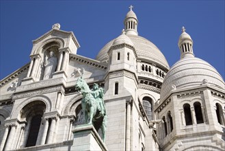 FRANCE, Ile de France, Paris, Montmartre The Church of Sacre Coeur or Sacred Heart with the bronze