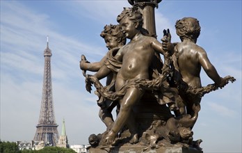 FRANCE, Ile de France, Paris, "Art Nouveau cherubs on a lamp-post on Ponte Alexandre III bridge