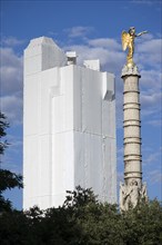 FRANCE, Ile de France, Paris, Les Halles. A gilded statue on top of a column in Place du Chatelet