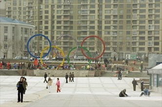 CHINA, Liaoning, Dalian, Repairing square in downtown Dalian displaying Olympic symbol