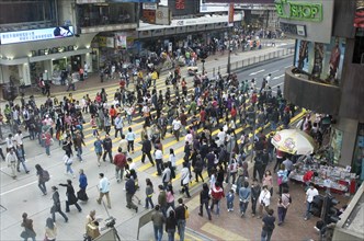 CHINA, Hong Kong, Hong Kong, Pedestrians in Mong Kok crossing Nathan Road