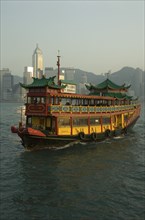 CHINA, Hong Kong, Hong Kong, Tourist boat and Victoria Island skyline
