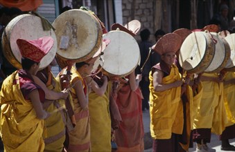 INDIA, Ladakh, Music, Tibetan Buddhist lamas in ceremonial dress playing traditional drums