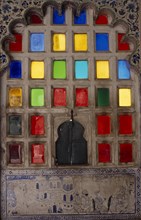 INDIA, Rajasthan, Udaipur, Stained glass window and decorated surround.
