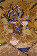 INDIA, Ladakh, Tikse Gompa, Fresco on Buddhist monastery wall depicting Guru Padmasambhava the