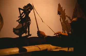 INDONESIA, Java, Shadow Puppets, "Wayang Kulit shadow puppet performance.  Puppet master or Dalang